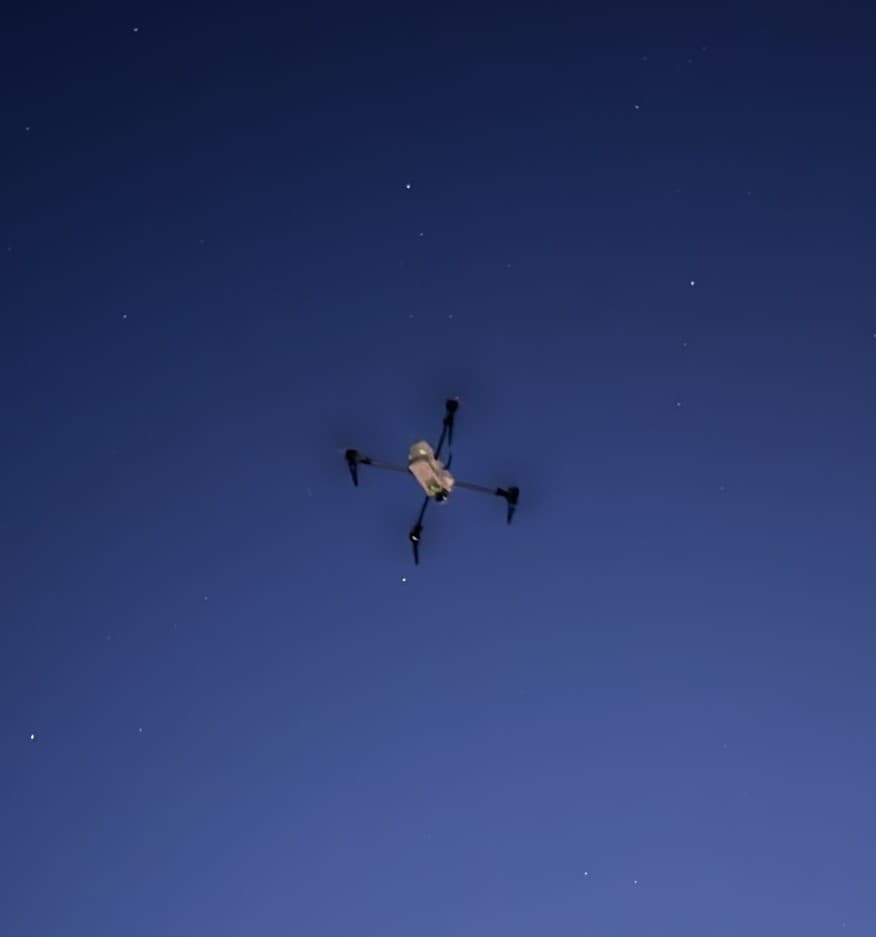 Drone flying overhead during a repeater deployment